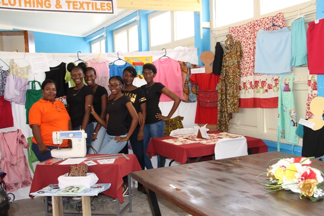 Clothing and Textiles tutor at the Charlestown Secondary School Multi-Purpose Centre Ms. Mavis Parris and her students showing off their work at the school’s auditorium at their Technology and Art Exhibition on May 26, 2016
